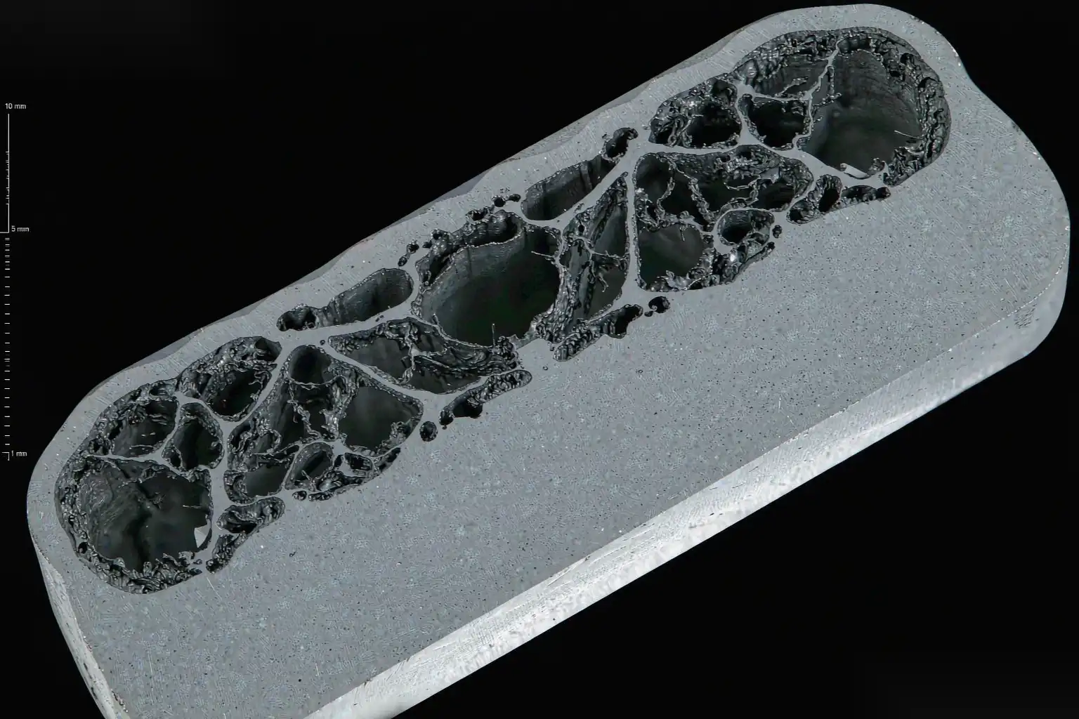 Aluminum die casting part cross-section showing shrinkage porosity