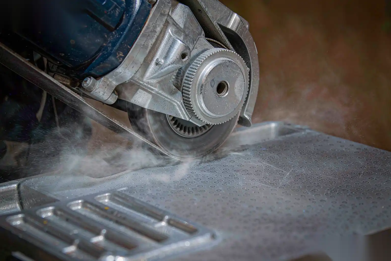 Belt grinding preparation of die cast aluminum before anodizing
