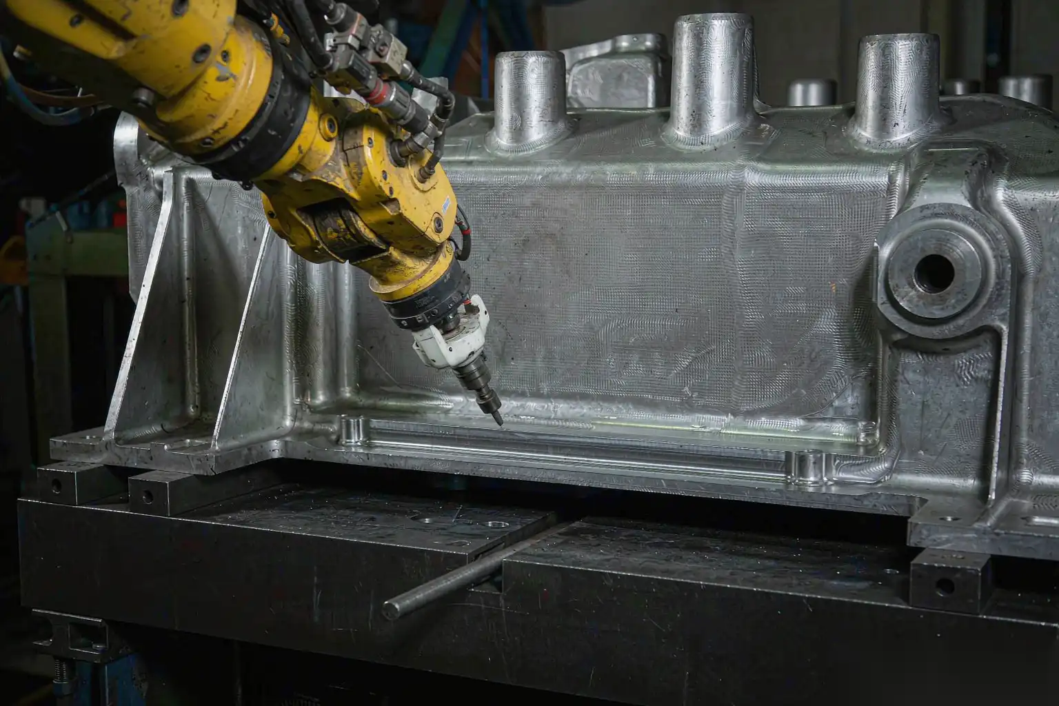 Robotic deburring of a large die cast structural automotive part