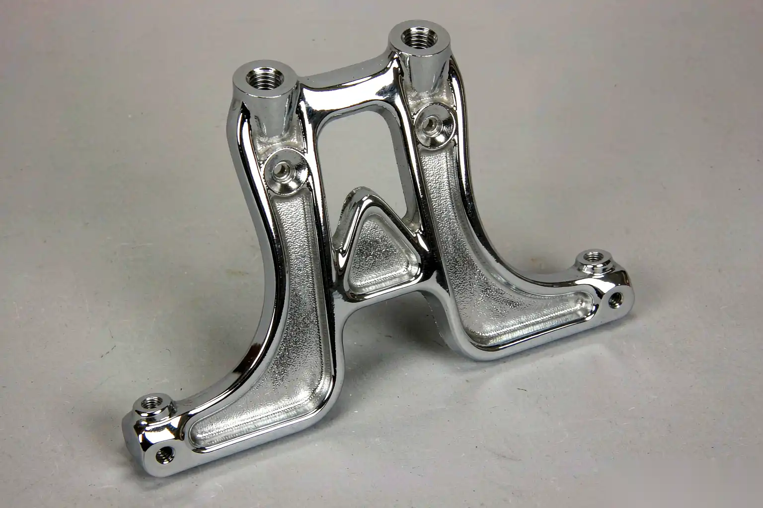 Polished die cast e-bike bracket with visible surface