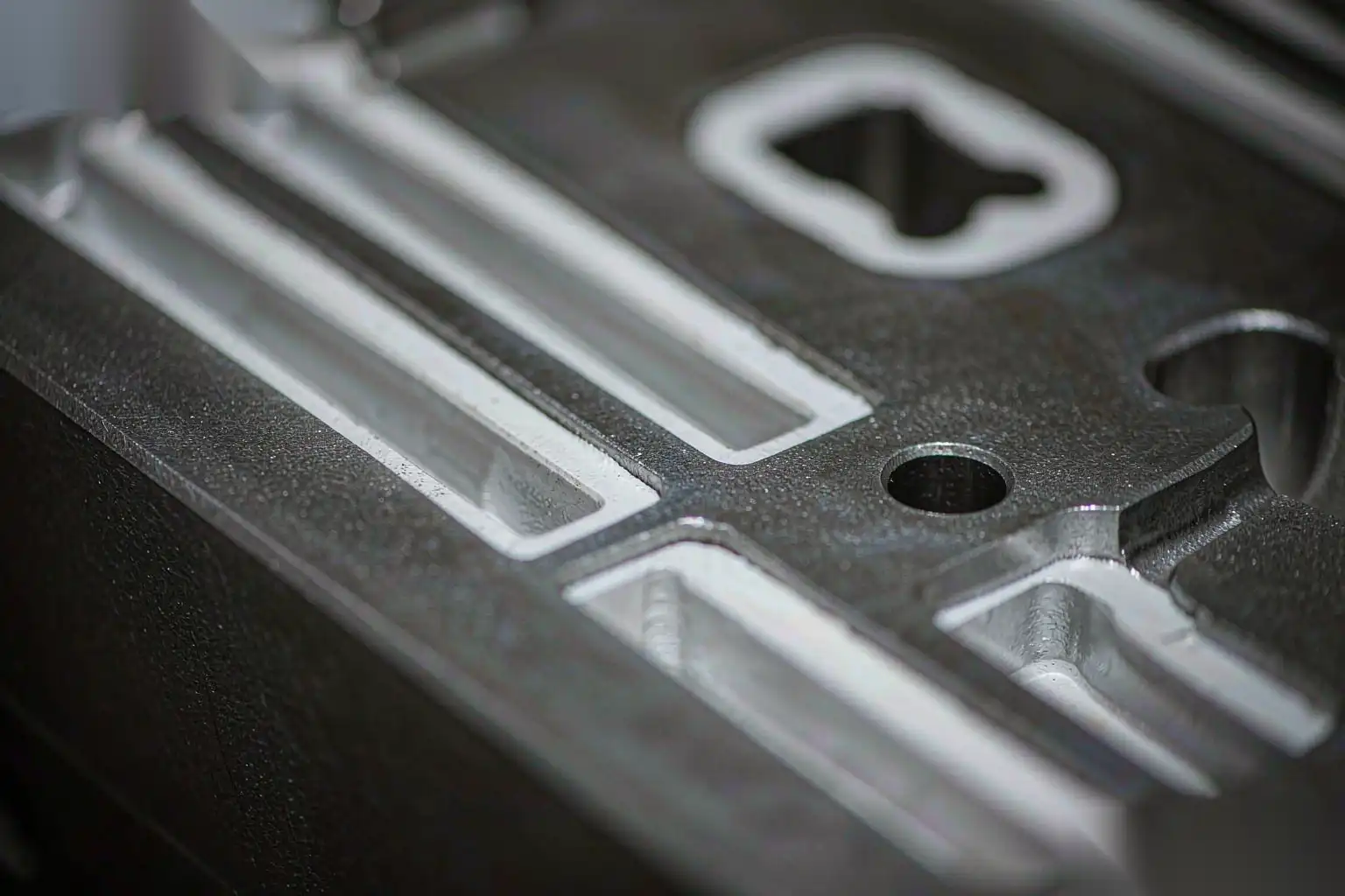 Close-up of the machined surface and parting line of a die-cast part