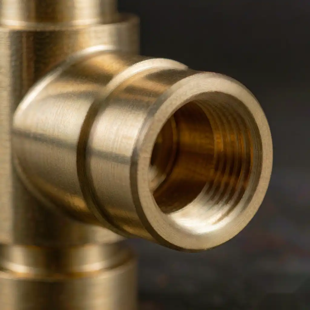 Precision machined brass faucet body showing a clean threaded seat and groove