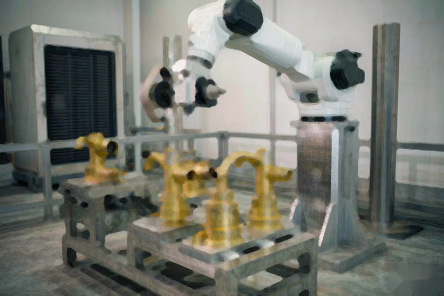Robotic grinding cell blending parting lines and radii on brass faucet bodies