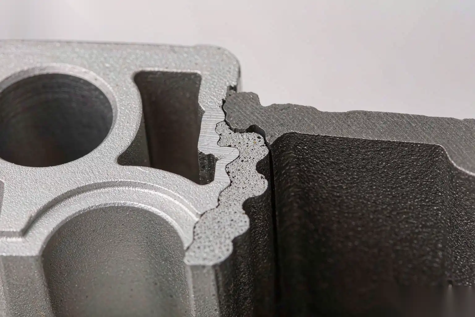 Cross section of an insert die cast part showing the insert bond