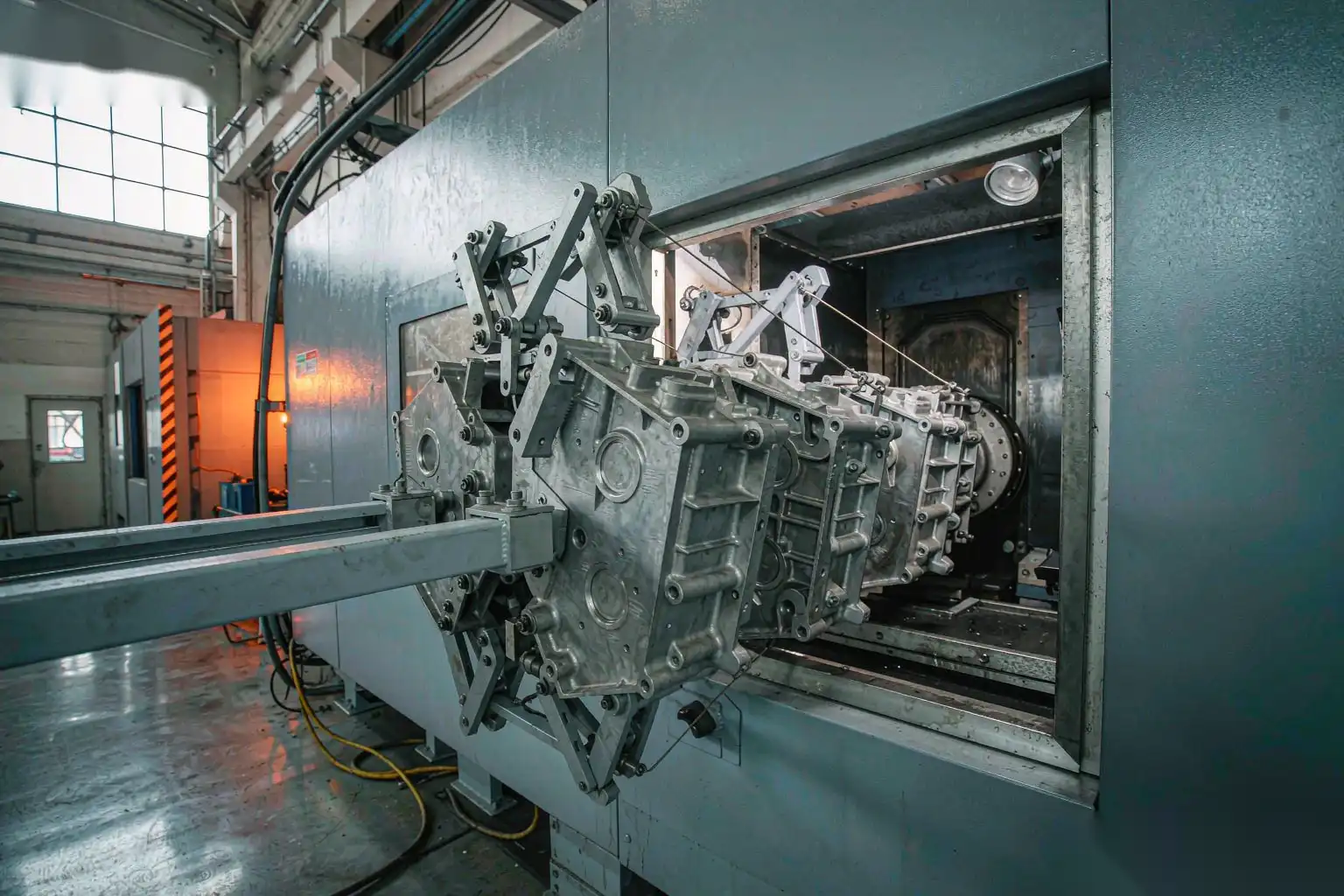 OEM die cast aluminum components on an automated finishing line
