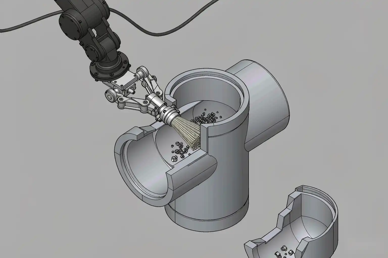 Diagram of a robotic deburring cell reaching inside a pipe fitting bore with a compliant brush tool