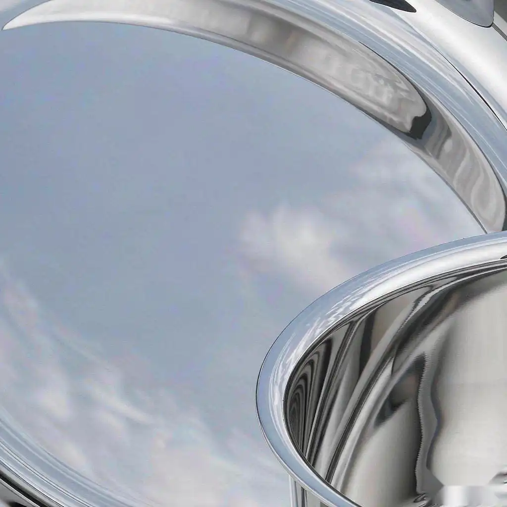 Finished stainless cookware showing a bright uniform mirror surface free of pits